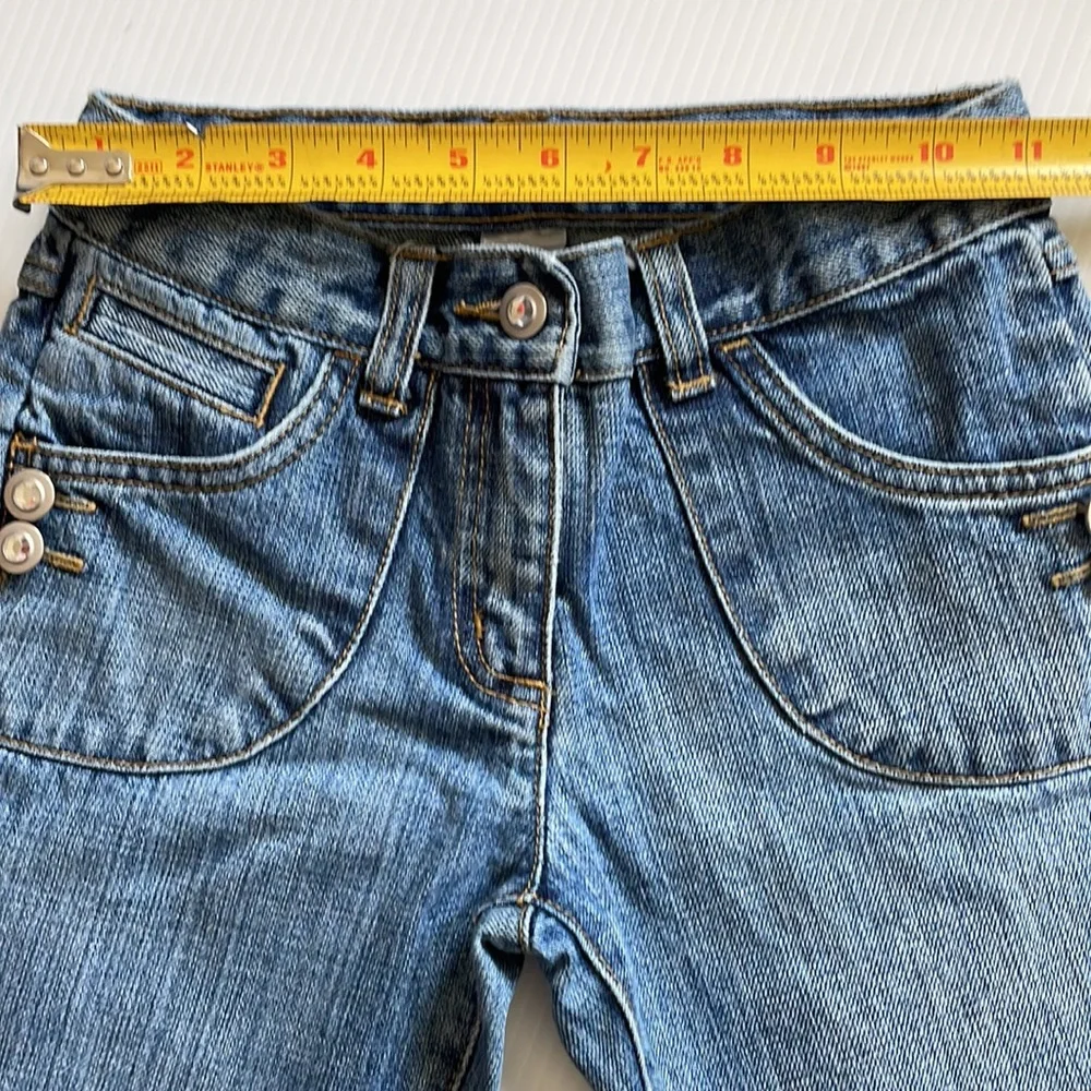 Gymboree flared jeans with gem buttons.  Girls size 7
